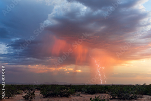 Sunset storm clouds with lightning in New Mexico