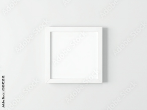 A white picture frame on a white wall