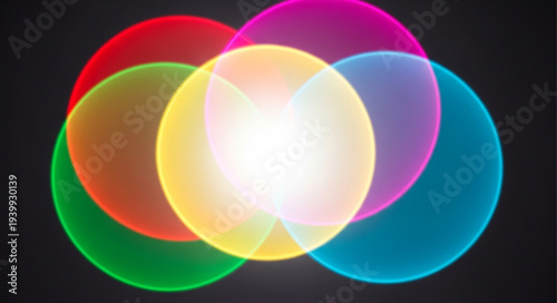Abstract colorful light circles overlapping and blending together.