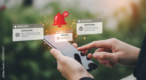 Hands holding smartphone with floating notification and red bell