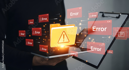Hands holding tablet with glowing yellow warning folder and red error alerts