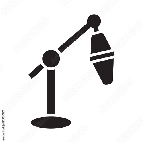 A black and white icon of a microphone on a stand