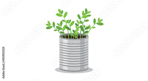 Green leafy plant growing out of a recycled silver tin can used as a decorative pot against a plain white background for eco living.