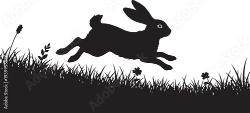 Silhouette of a rabbit jumping over grass and flowers