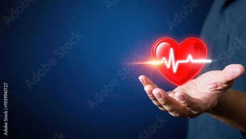 Hand holding red heart with glowing ecg line on blue background healthcare concept