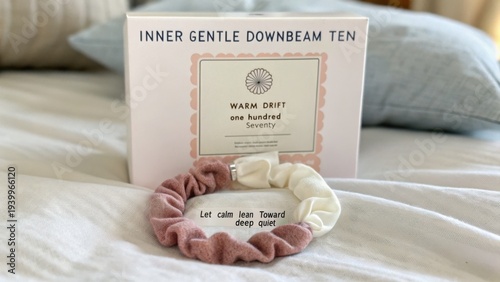 Soft Hair Accessories on Cozy Bed with Decorative Box Featuring Calming Text and Warm Drift Packaging Style