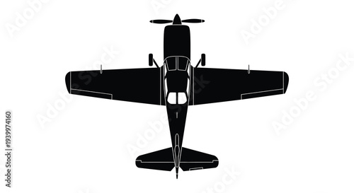 A stark black silhouette of a single engine airplane viewed from directly above a striking silhouette
