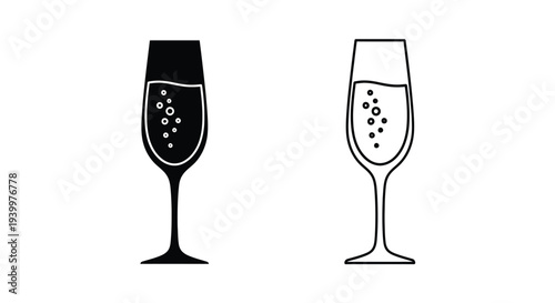 Two champagne glasses one filled and one empty in black and white