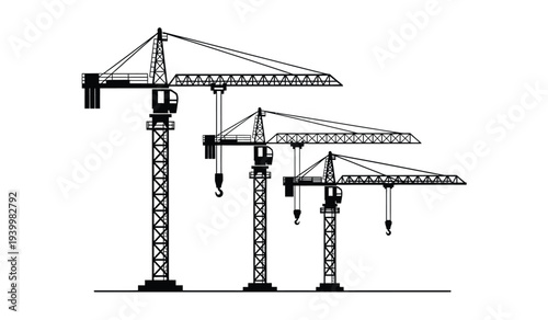 Three tower cranes of different heights standing in a row