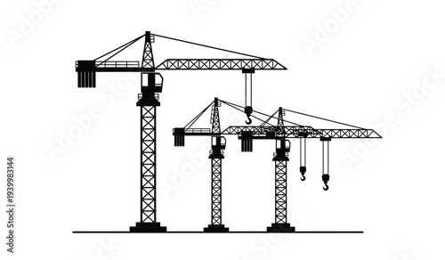 Three cranes with lattice towers and counterweights