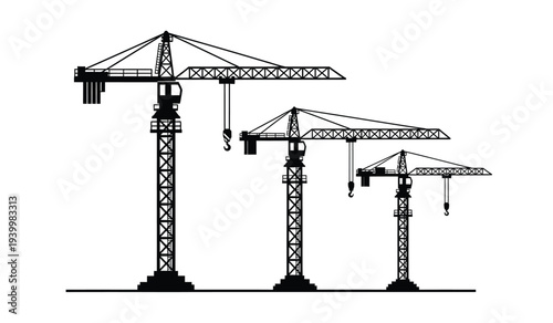 Three construction cranes of varying heights standing in a row