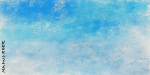 Beautiful abstract grunge background of a clear blue summer sky with fluffy white clouds and natural sunlight creating a heavenly atmosphere