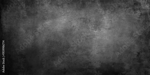 A dark vintage metal background with a dirty grunge texture and aged gray concrete pattern provides a blank black space for design text on an old textured wall surface