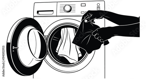 A stark black silhouette of a hand loading laundry into a front loading washing machine domestic chore silhouette