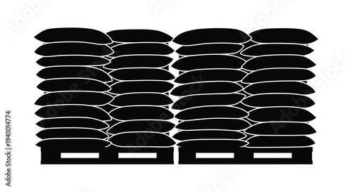 A tightly packed arrangement of stacked sandbags creates a solid barrier presented in stark silhouette high quality professional