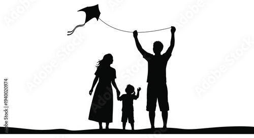 A family enjoys a sunny day at the beach flying a kite with a beautiful stark silhouette