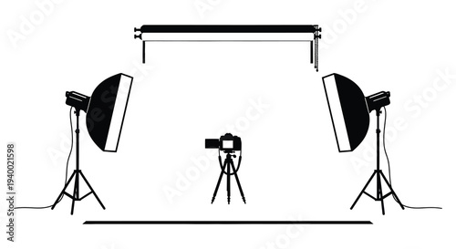 A studio setup featuring photographic equipment including lights a camera and a backdrop in silhouette high quality professional