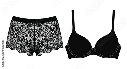A black lace bra and matching boy shorts are displayed in a flat lay composition a striking silhouette
