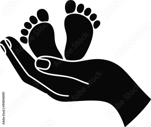 Black silhouette of a hand gently holding tiny baby feet with toes visible care