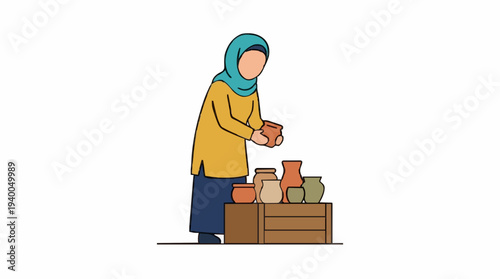 Woman in Teal Hijab and Yellow Tunic Arranging Pottery Vases on a Brown Wooden Crate Against a White Background