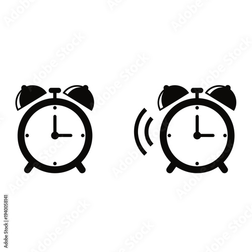 Two black and white alarm clocks ringing