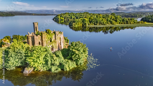 Fotografia Aerial drone view of woman paddling SUP board on beautiful Lough Key lake with M