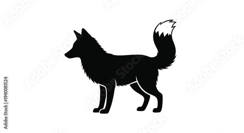 Silhouette of a fox with a bushy tail facing to the left