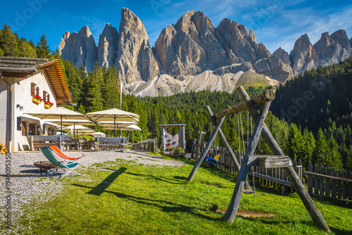 Alpine restaurant with outdoor resting place in the Dolomites, Italy