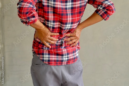 Man suffering from back pain, have a backache, health problems, human pain concept.