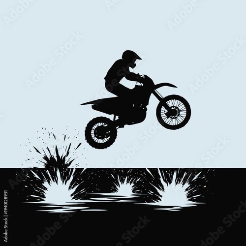 Rider in mid-air on dirt bike performing jump stunt outdoors