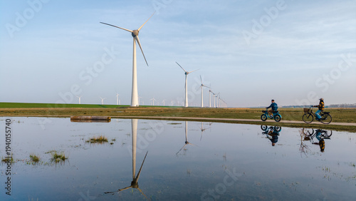 Exploring sustainable energy through windmills in Urk, Flevoland on a clear day
