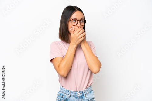 Young caucasian woman isolated on white background covering mouth and looking to the side