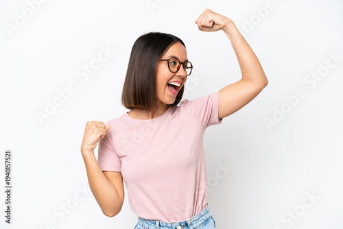 Young caucasian woman isolated on white background celebrating a victory