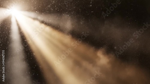 Blurry close-up of a road with headlights shining brightly in the dark with rain and snowflakes