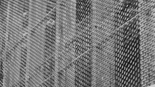 Woven plaid texture shows worn wool fibers in charcoal tones