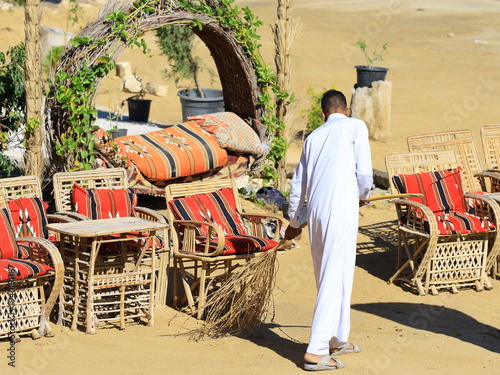 Man sweeping outside (Siwa, Egypt)