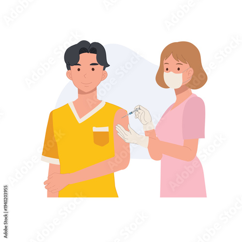 Female nurse administering vaccination to a young male patient in a clinic setting during a healthcare immunization campaign