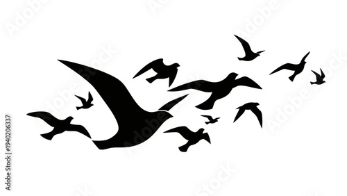 Silhouettes of flying birds in a flock against a white background.