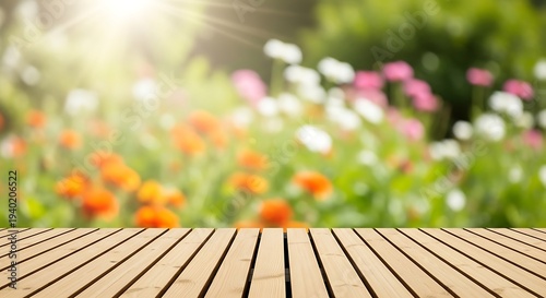 Wooden deck table top with colorful flowers and greenery in background garden scene