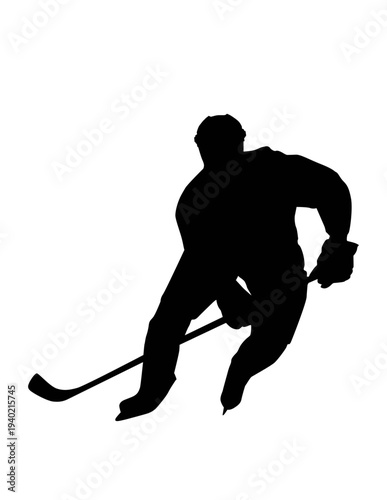 Hockey player in action with stick on ice rink