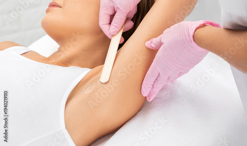 Elos epilation hair removal procedure on a woman’s body. Beautician doing laser rejuvenation in a beauty salon. Removing unwanted body hair. Hardware ipl cosmetology