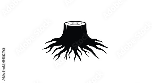 A dark silhouette of a tree stump with exposed roots silhouette