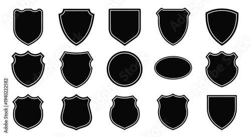 Collection of diverse shield and emblem shapes in black silhouette
