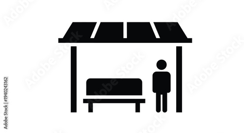 A bus stop with a person waiting under a shelter silhouette