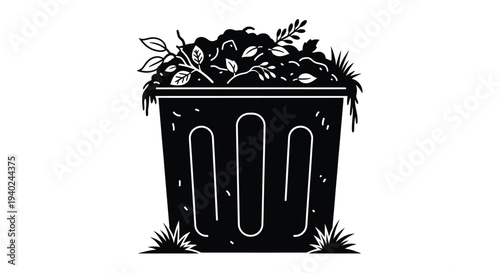 Overflowing trash can with foliage a striking black silhouette