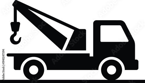 A black and white image of a tow truck with a hook