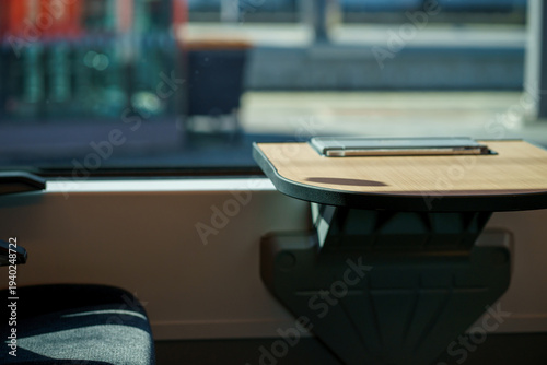 Schilderij op canvas Minimalist interior of a modern train with wooden table near window