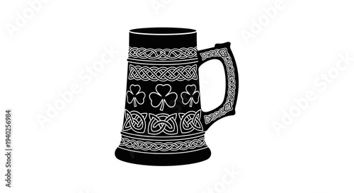 A traditional beer stein with intricate designs and patterns on a white background.