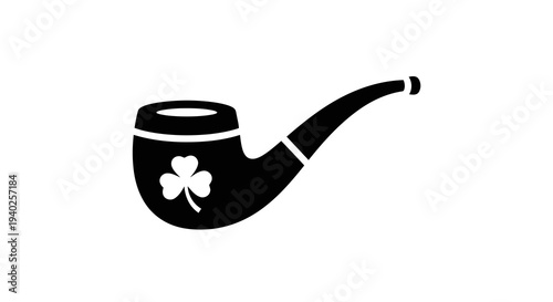 A black pipe with a four-leaf clover on it against a white background.