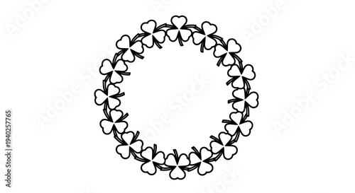 A circular pattern of intertwined shapes forming a ring structure.